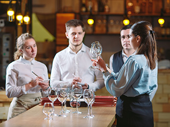 Bartender holding a wine glass